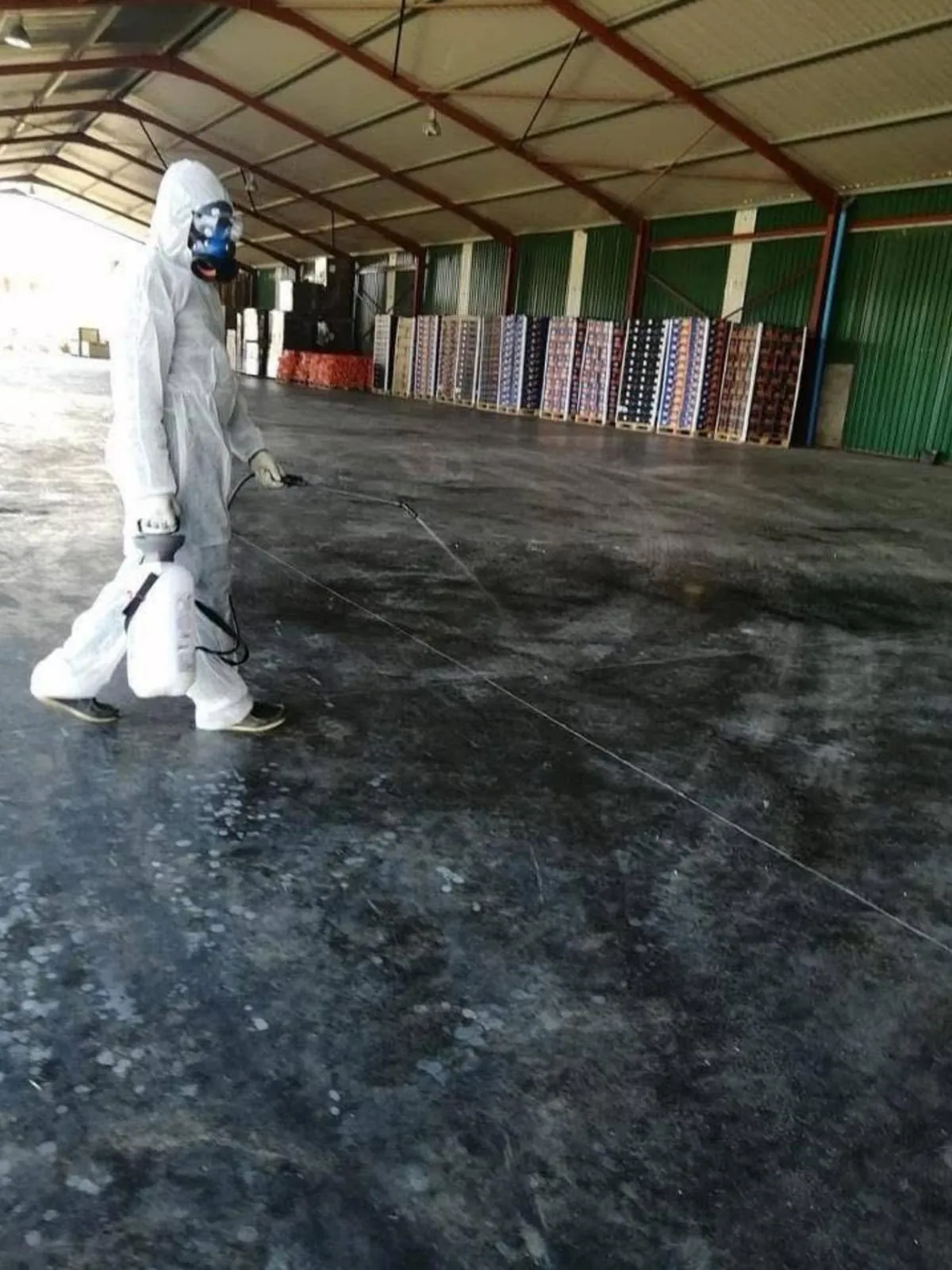ASC registered operator carrying out ULV fogging in a large warehouse